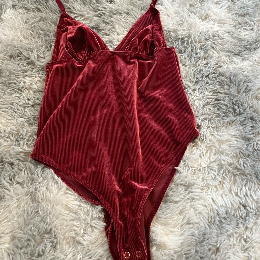 pink velvet body suit.